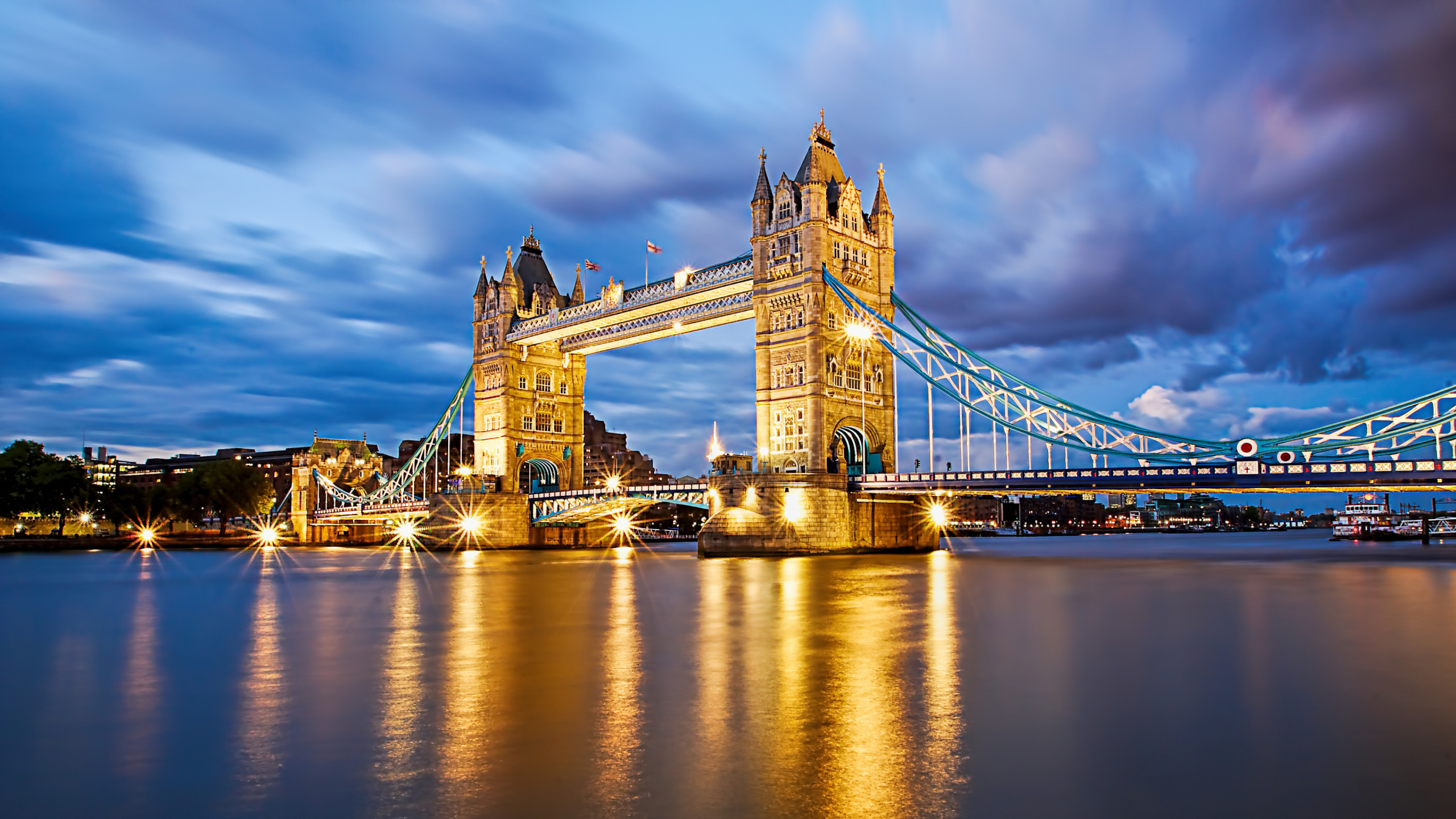 Bridge Over Water During Night Time. Wallpaper in 2560x1440 Resolution
