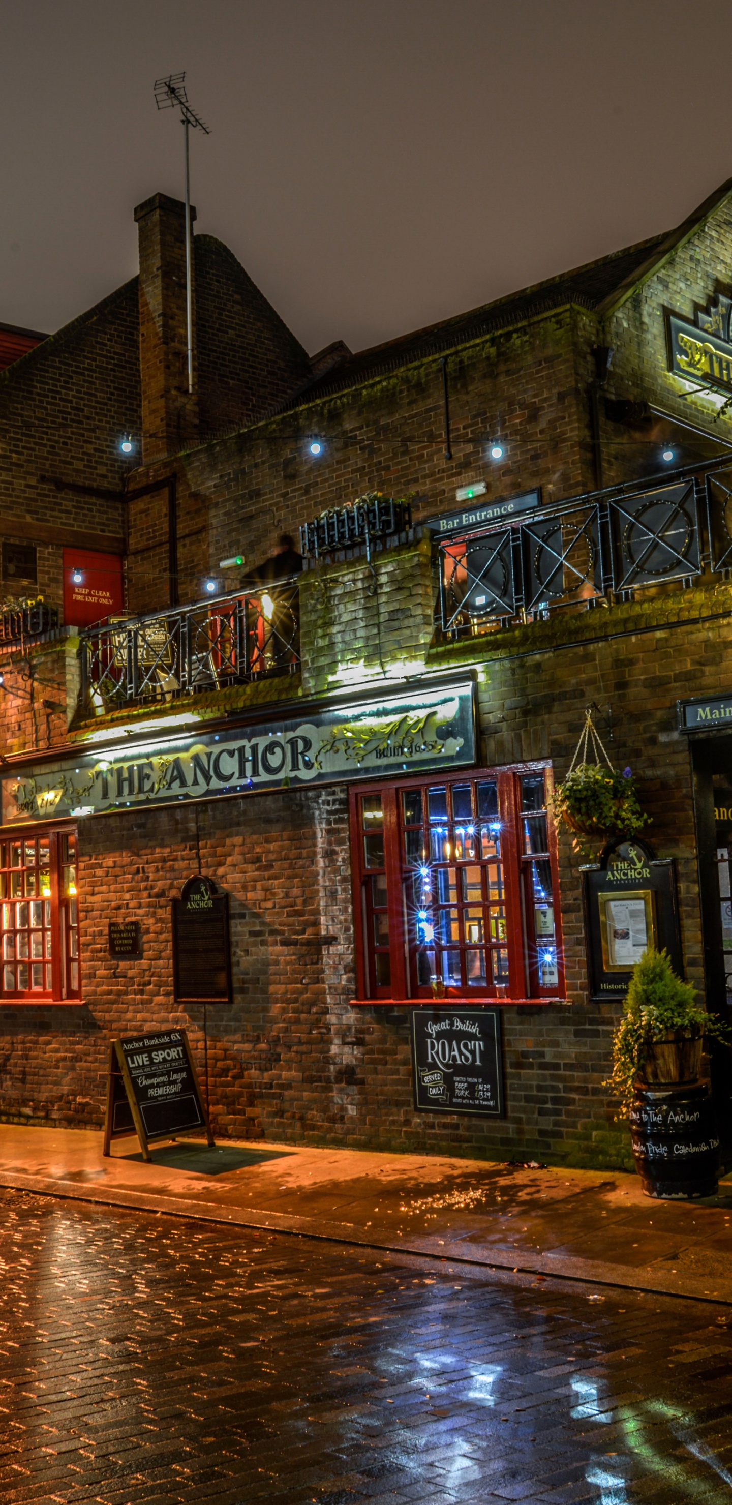 Brown and Beige Concrete Building During Night Time. Wallpaper in 1440x2960 Resolution