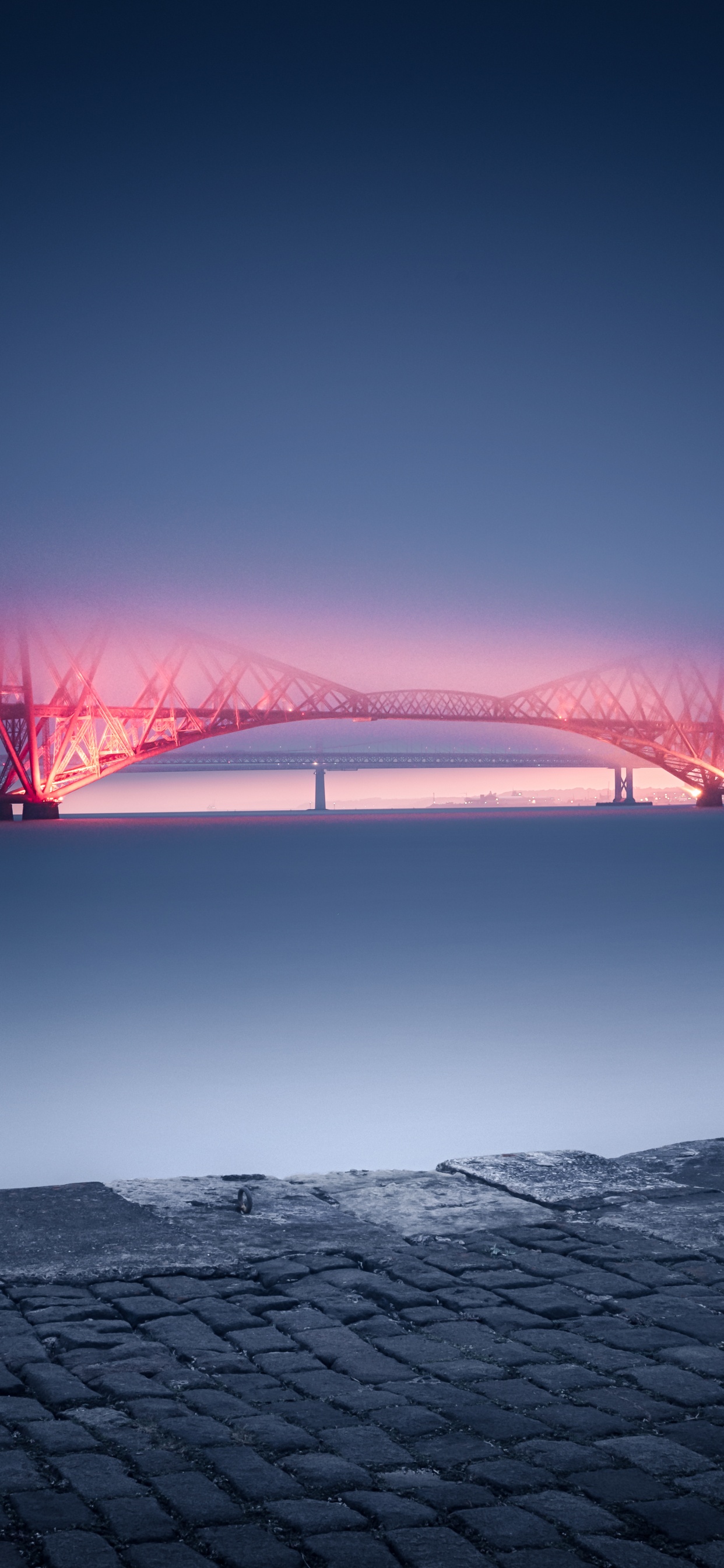 Red Bridge Over Body of Water During Night Time. Wallpaper in 1242x2688 Resolution