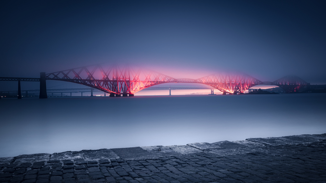 Red Bridge Over Body of Water During Night Time. Wallpaper in 1366x768 Resolution