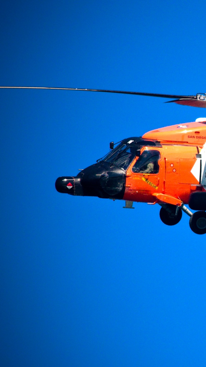 Orange and White Helicopter Flying in The Sky During Daytime. Wallpaper in 720x1280 Resolution
