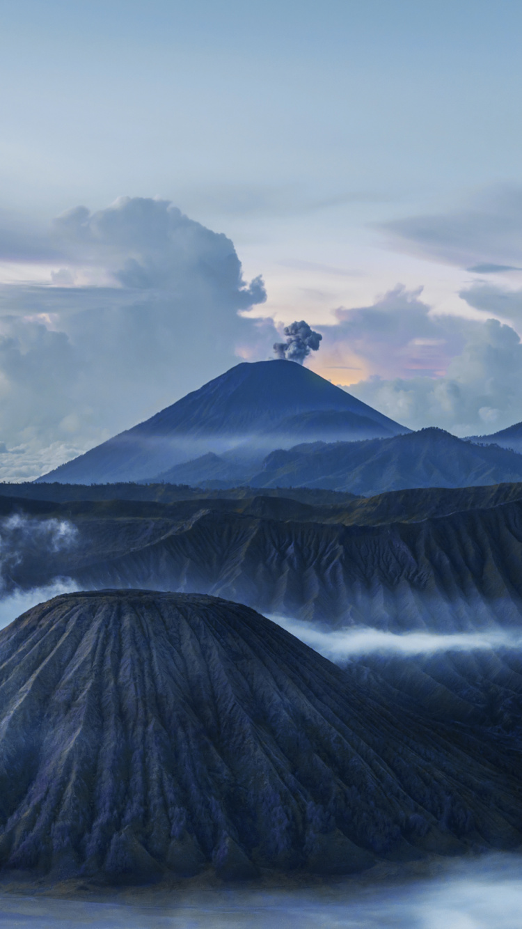 Black and White Mountain Under White Clouds During Daytime. Wallpaper in 750x1334 Resolution