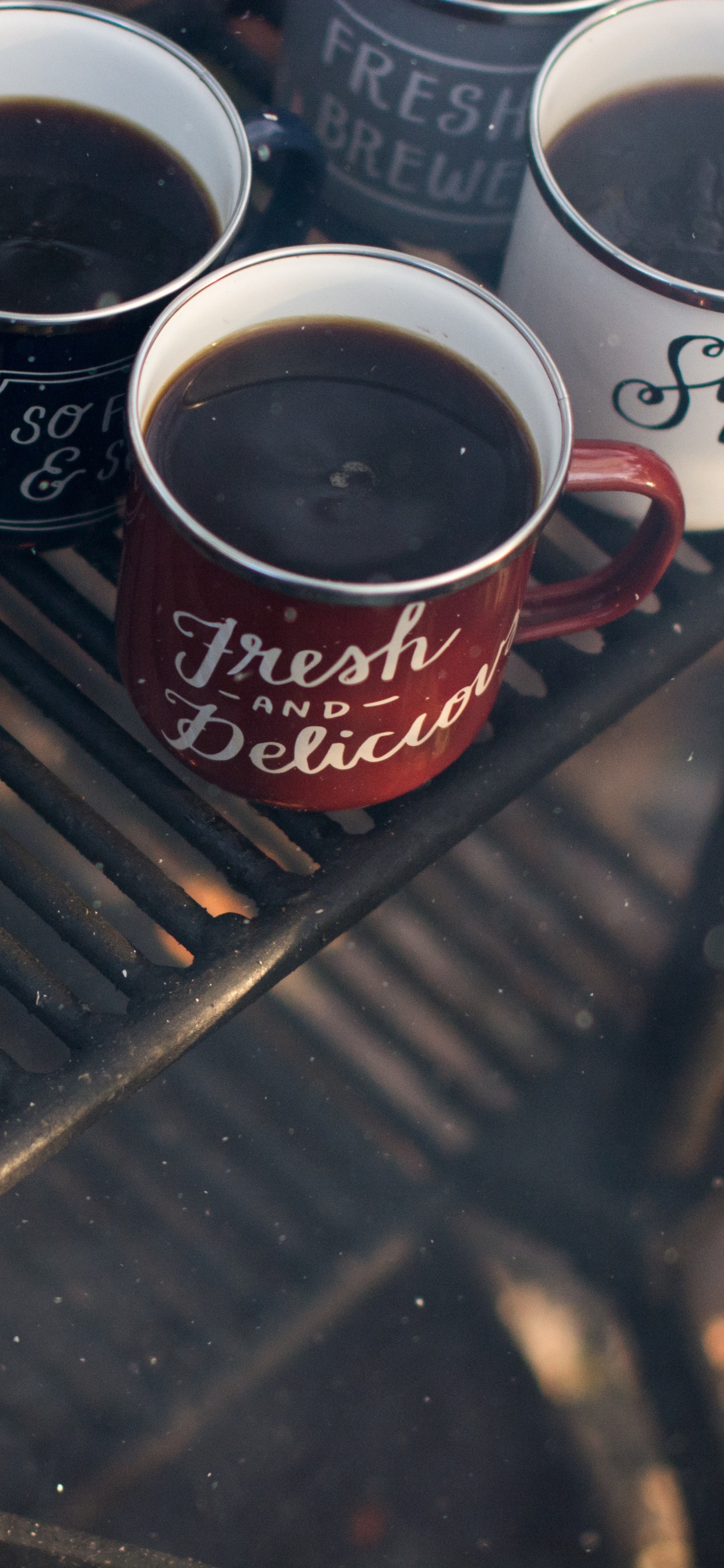 Red and White Coffee Cup on Black Metal Frame. Wallpaper in 1242x2688 Resolution