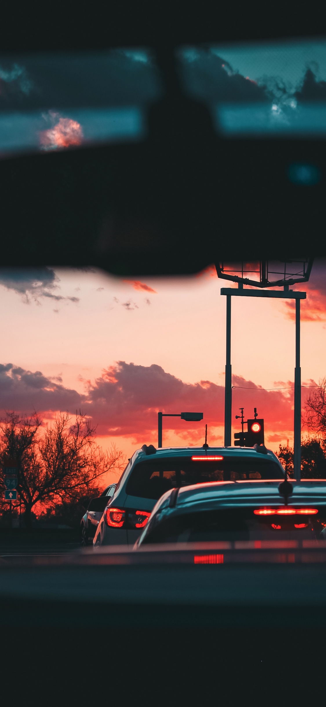 Cars on Road During Sunset. Wallpaper in 1125x2436 Resolution