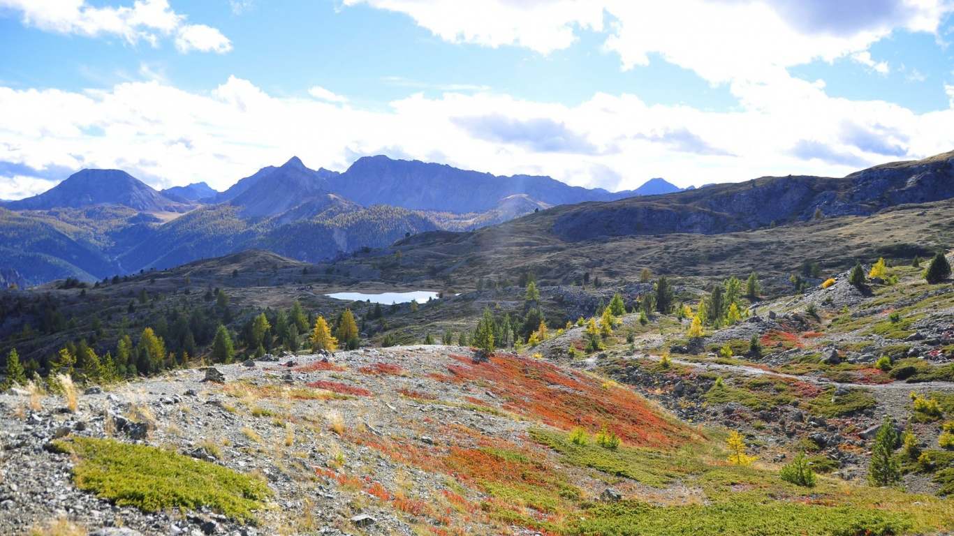 Green and Brown Mountains Under Blue Sky During Daytime. Wallpaper in 1366x768 Resolution
