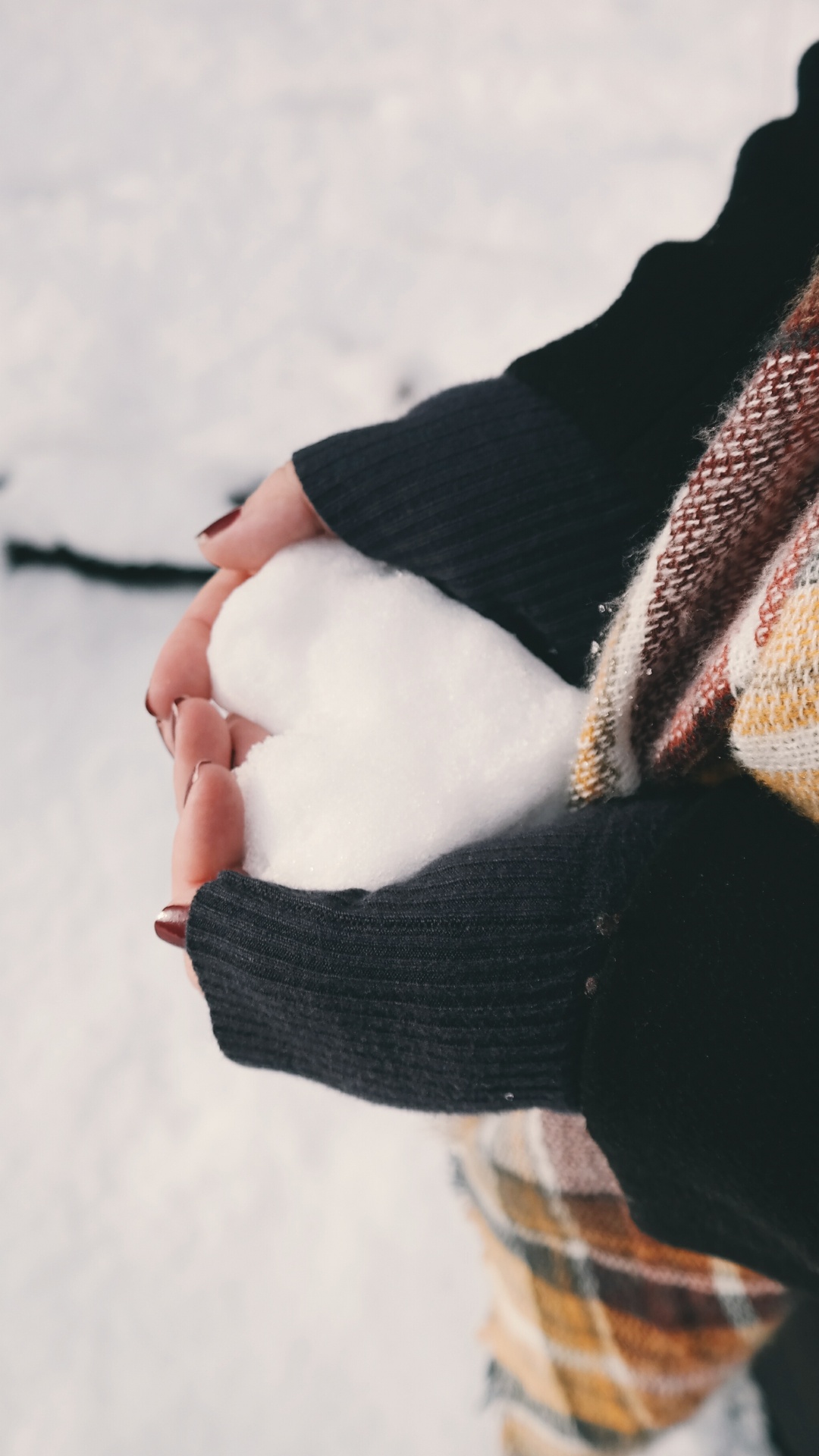 Person in Black Sweater Holding Brown and White Scarf. Wallpaper in 1080x1920 Resolution