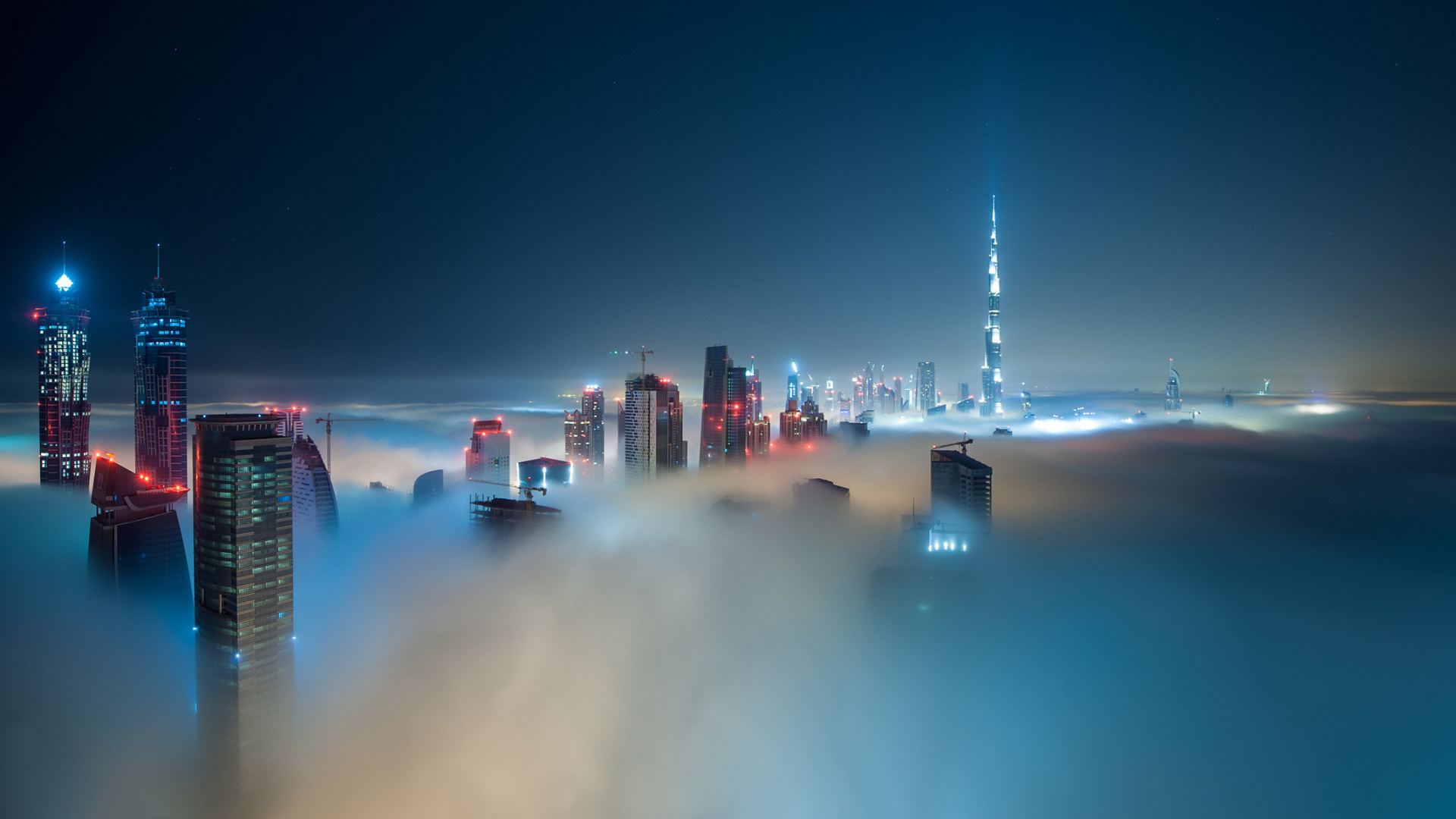 City Skyline With Lights Turned on During Night Time. Wallpaper in 1920x1080 Resolution