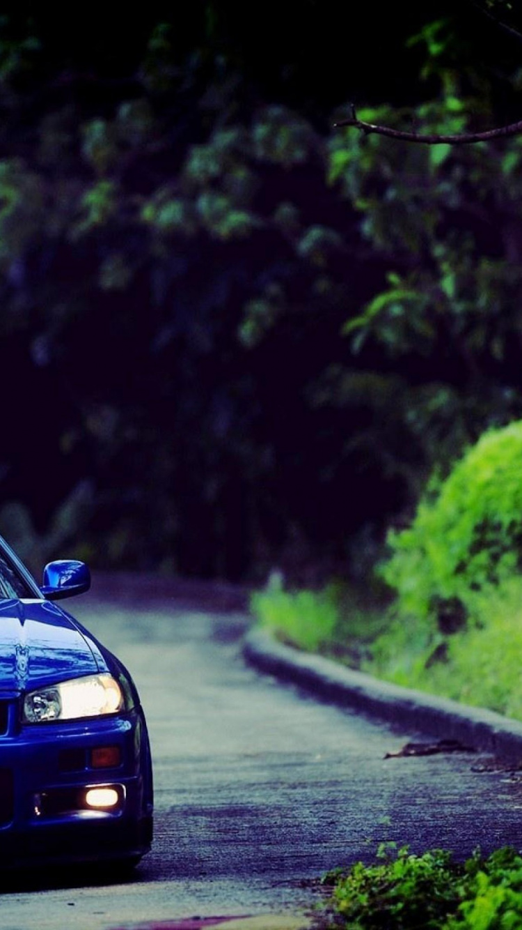 Blue Bmw m 3 on Road. Wallpaper in 750x1334 Resolution