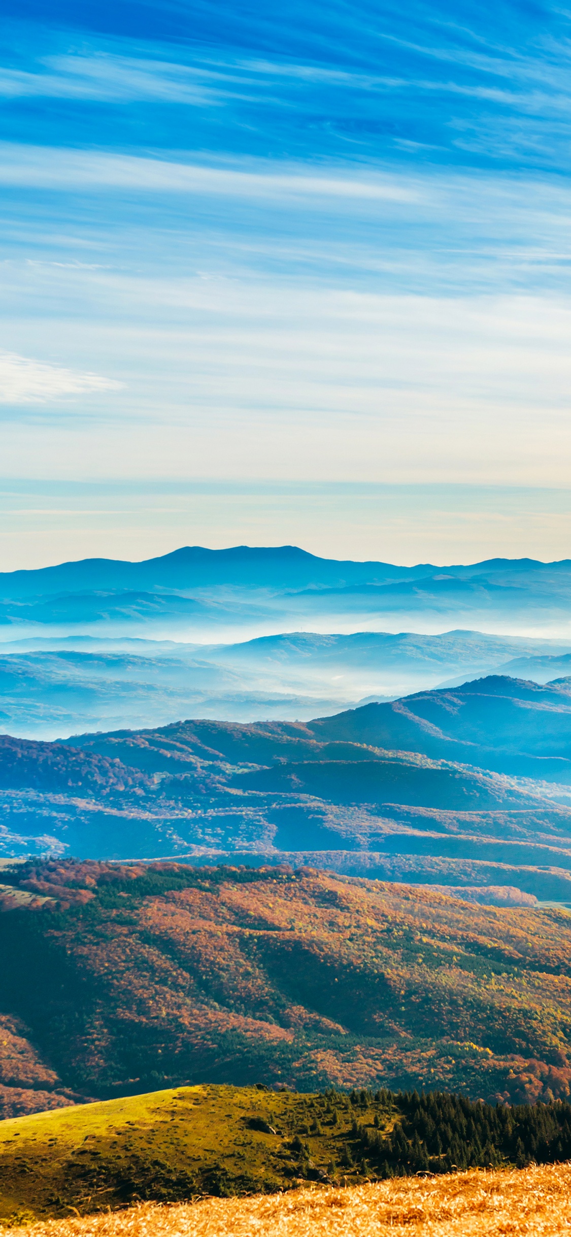 Brown and Green Mountains Under White Clouds and Blue Sky During Daytime. Wallpaper in 1125x2436 Resolution