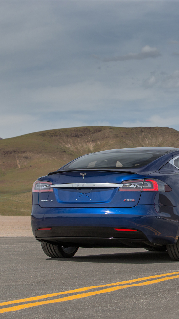 Blue Sedan on Gray Asphalt Road During Daytime. Wallpaper in 750x1334 Resolution