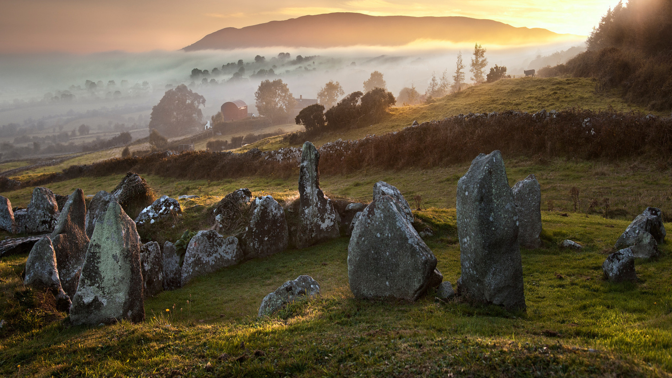 Gray Rock Formation on Green Grass Field During Daytime. Wallpaper in 1366x768 Resolution