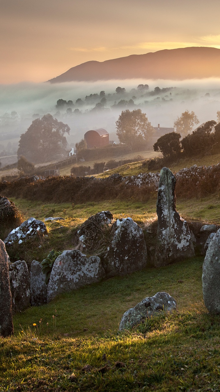 Gray Rock Formation on Green Grass Field During Daytime. Wallpaper in 720x1280 Resolution