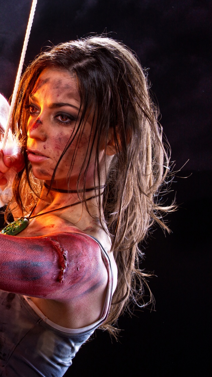 Man in Brown Long Sleeve Shirt Holding Brown Wooden Stick. Wallpaper in 720x1280 Resolution