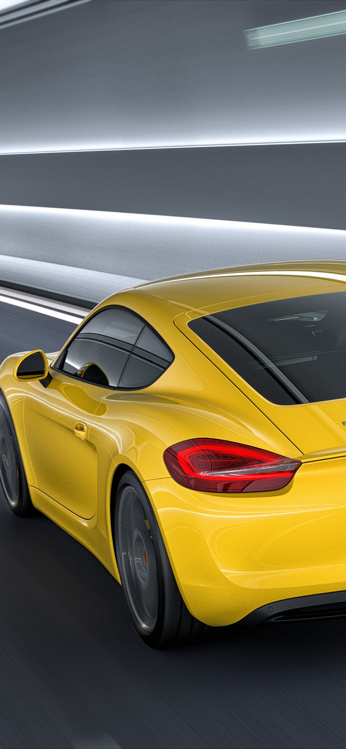Yellow Porsche 911 on Road. Wallpaper in 1125x2436 Resolution