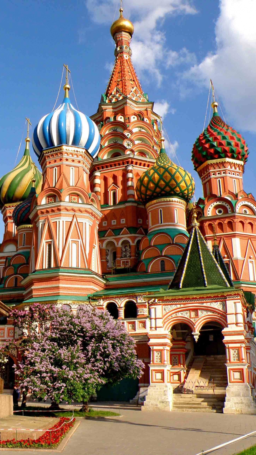 Brown and Green Concrete Building Under Blue Sky During Daytime. Wallpaper in 1080x1920 Resolution
