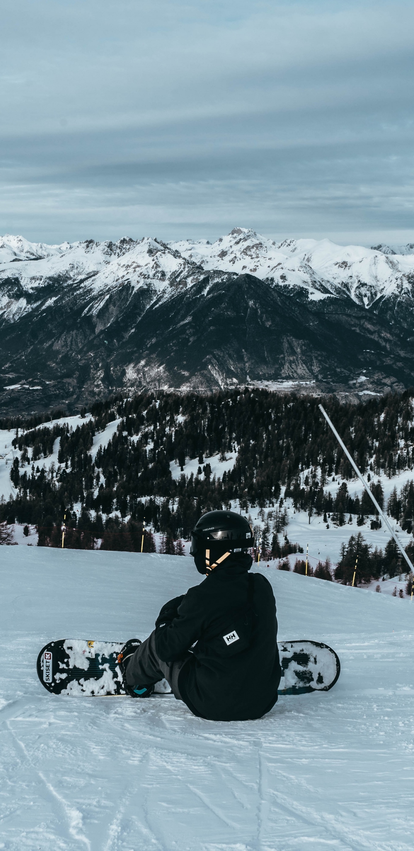Man in Black Jacket Riding on Black Motorcycle on Snow Covered Mountain During Daytime. Wallpaper in 1440x2960 Resolution