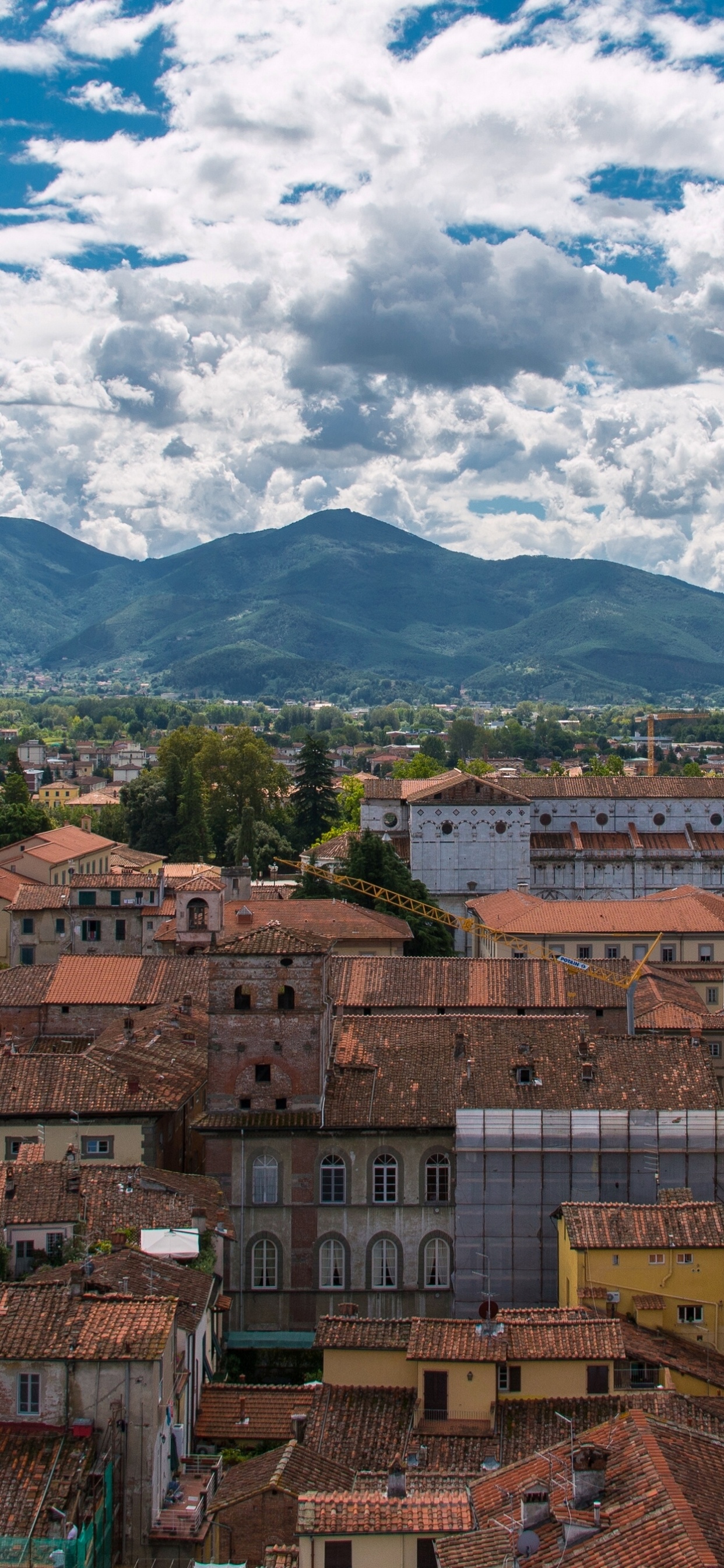 Brown Concrete Buildings Under White Clouds and Blue Sky During Daytime. Wallpaper in 1242x2688 Resolution