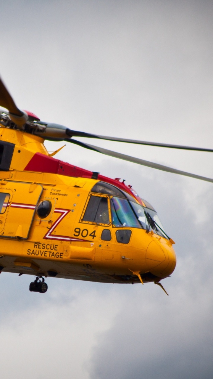 Yellow and Red Helicopter Flying in The Sky. Wallpaper in 720x1280 Resolution