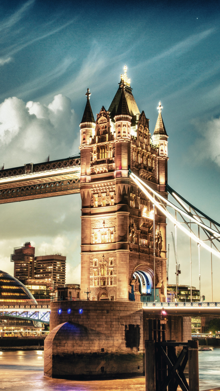 Brown Bridge Under Blue Sky During Night Time. Wallpaper in 750x1334 Resolution