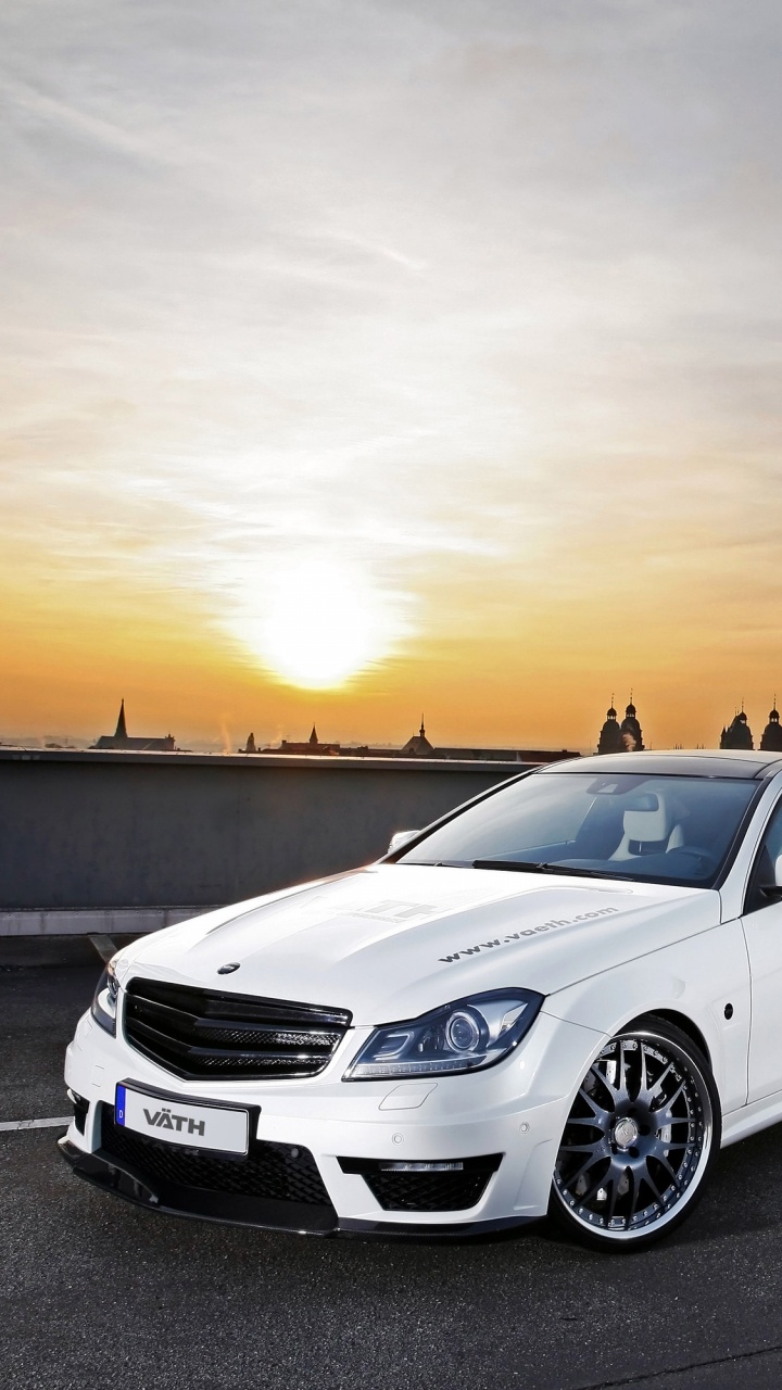 White Sedan on Gray Asphalt Road During Sunset. Wallpaper in 720x1280 Resolution