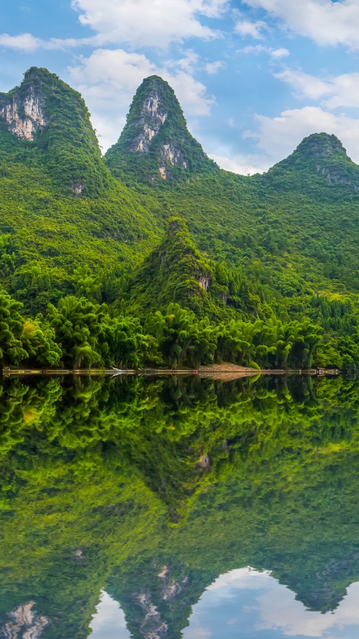 Green Mountain Beside Body of Water During Daytime. Wallpaper in 720x1280 Resolution