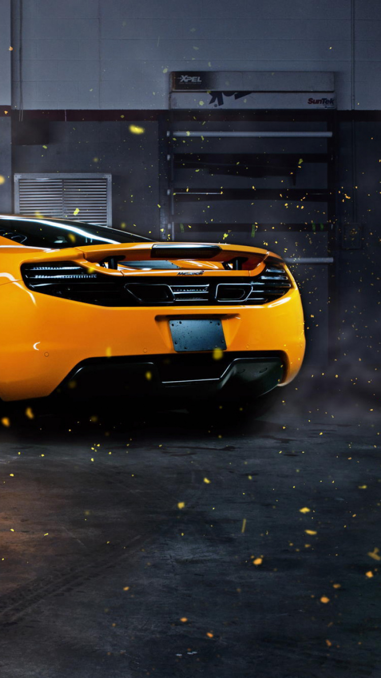 Orangefarbener Lamborghini Aventador Auf Schwarzem Bürgersteig Geparkt. Wallpaper in 750x1334 Resolution