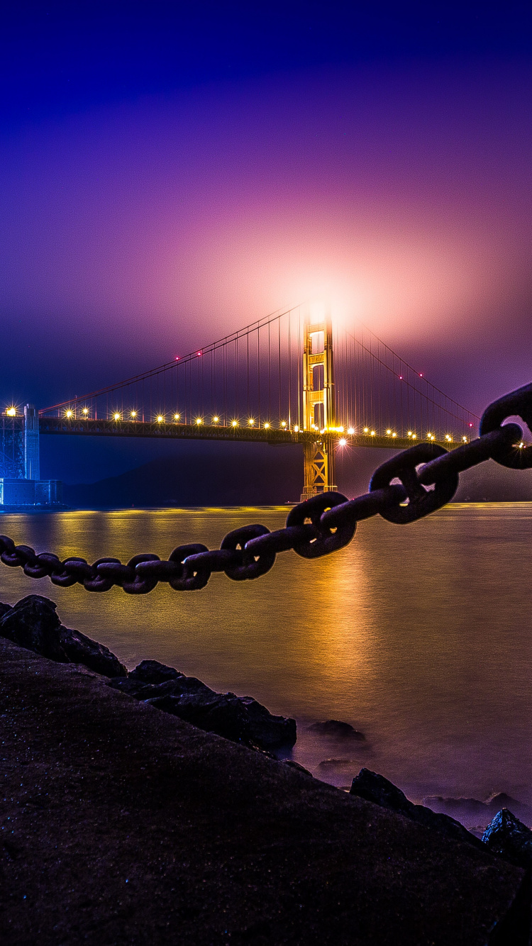 People Walking on Bridge During Night Time. Wallpaper in 750x1334 Resolution