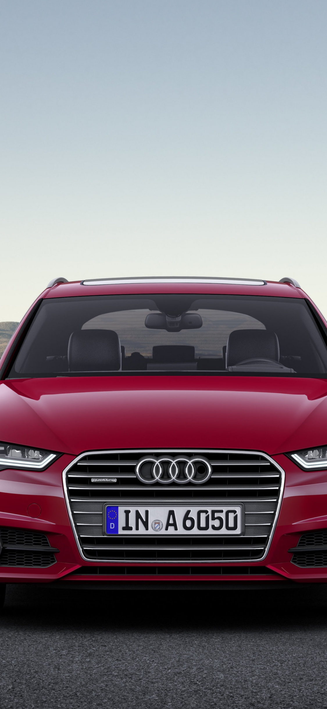 Red Audi a 4 on a Road. Wallpaper in 1125x2436 Resolution