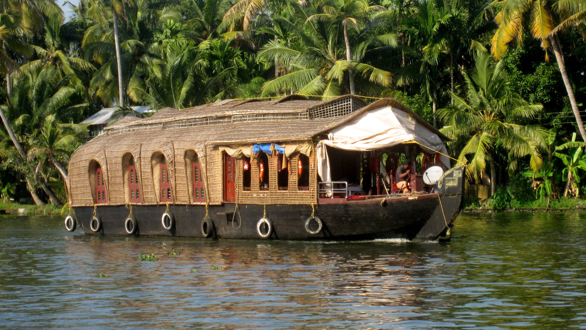 Brown Wooden Boat on Body of Water During Daytime. Wallpaper in 1920x1080 Resolution