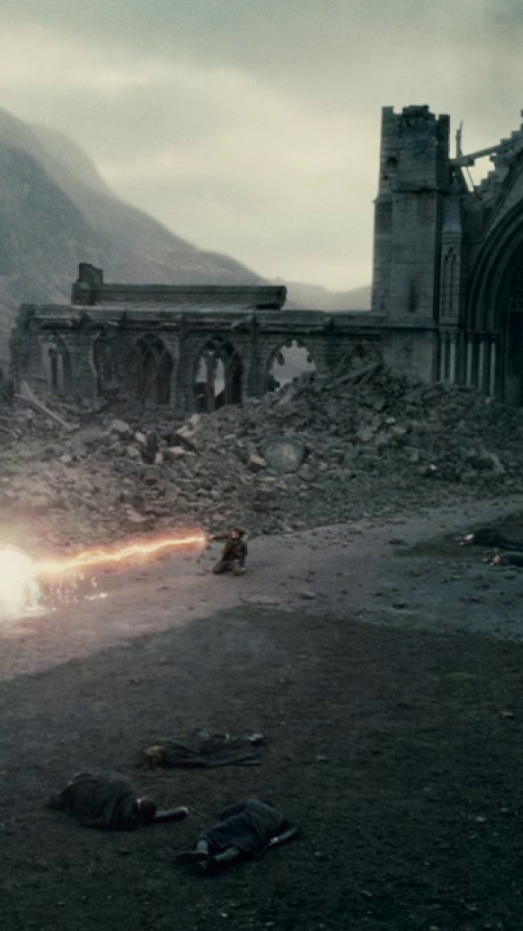 Gray Concrete Building Near Mountain During Daytime. Wallpaper in 750x1334 Resolution