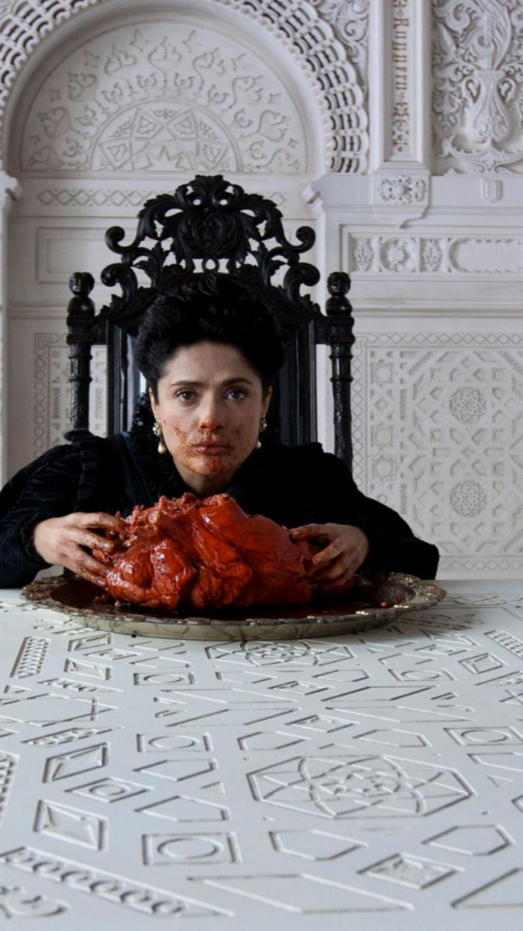 Frau im Schwarzen Langarmhemd Sitzt Auf Stuhl. Wallpaper in 750x1334 Resolution