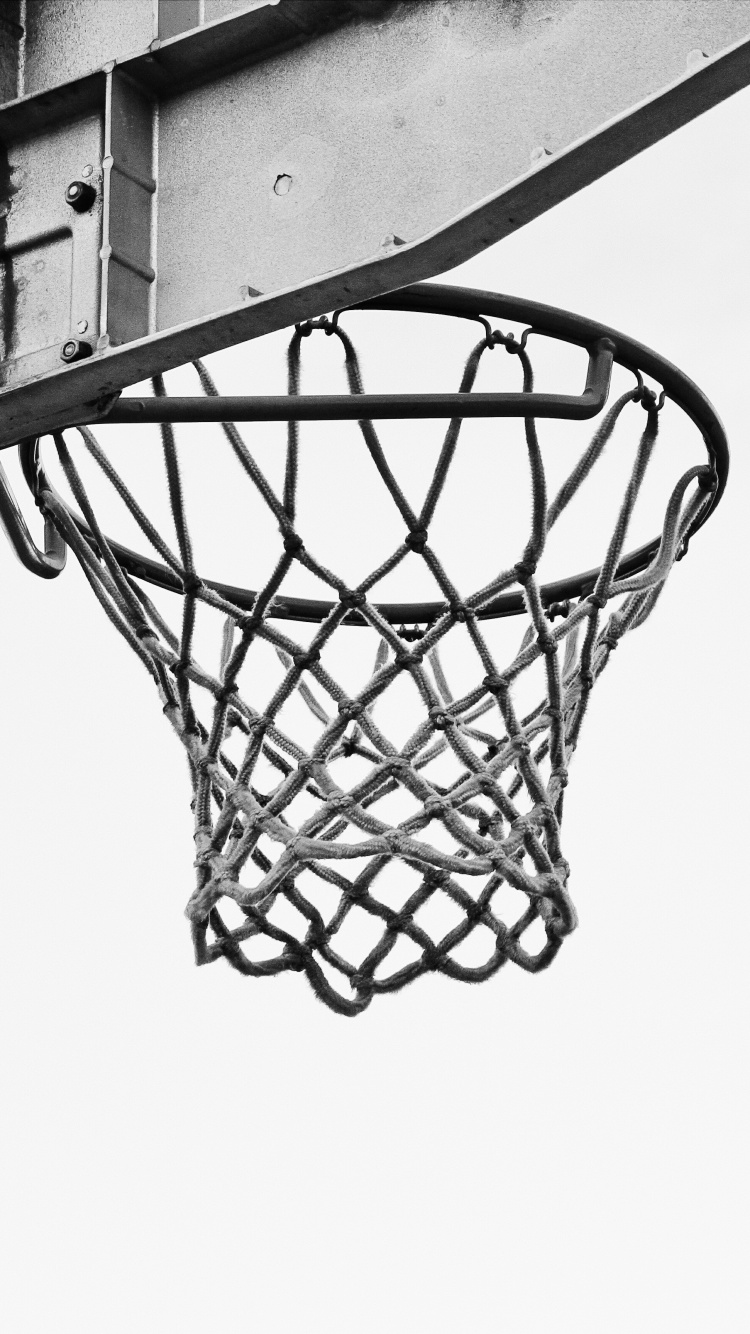 Basketball on Basketball Hoop in Grayscale Photography. Wallpaper in 750x1334 Resolution