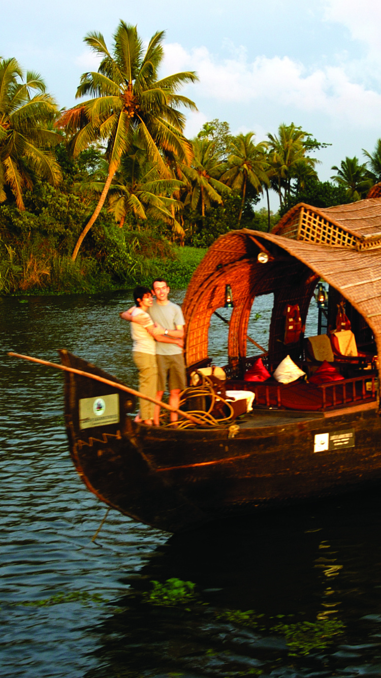 Brown Wooden Boat on Body of Water During Daytime. Wallpaper in 750x1334 Resolution