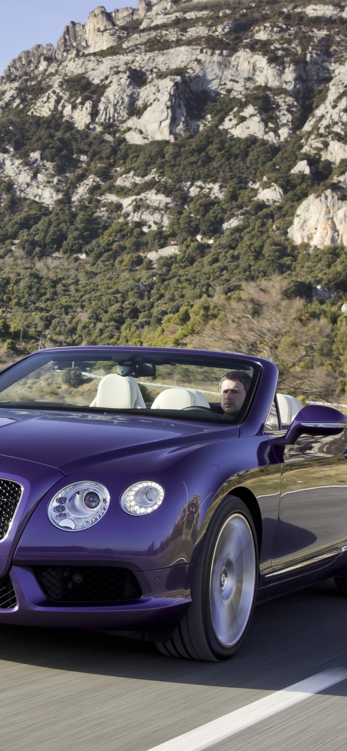 Purple Porsche 911 on Road During Daytime. Wallpaper in 1125x2436 Resolution