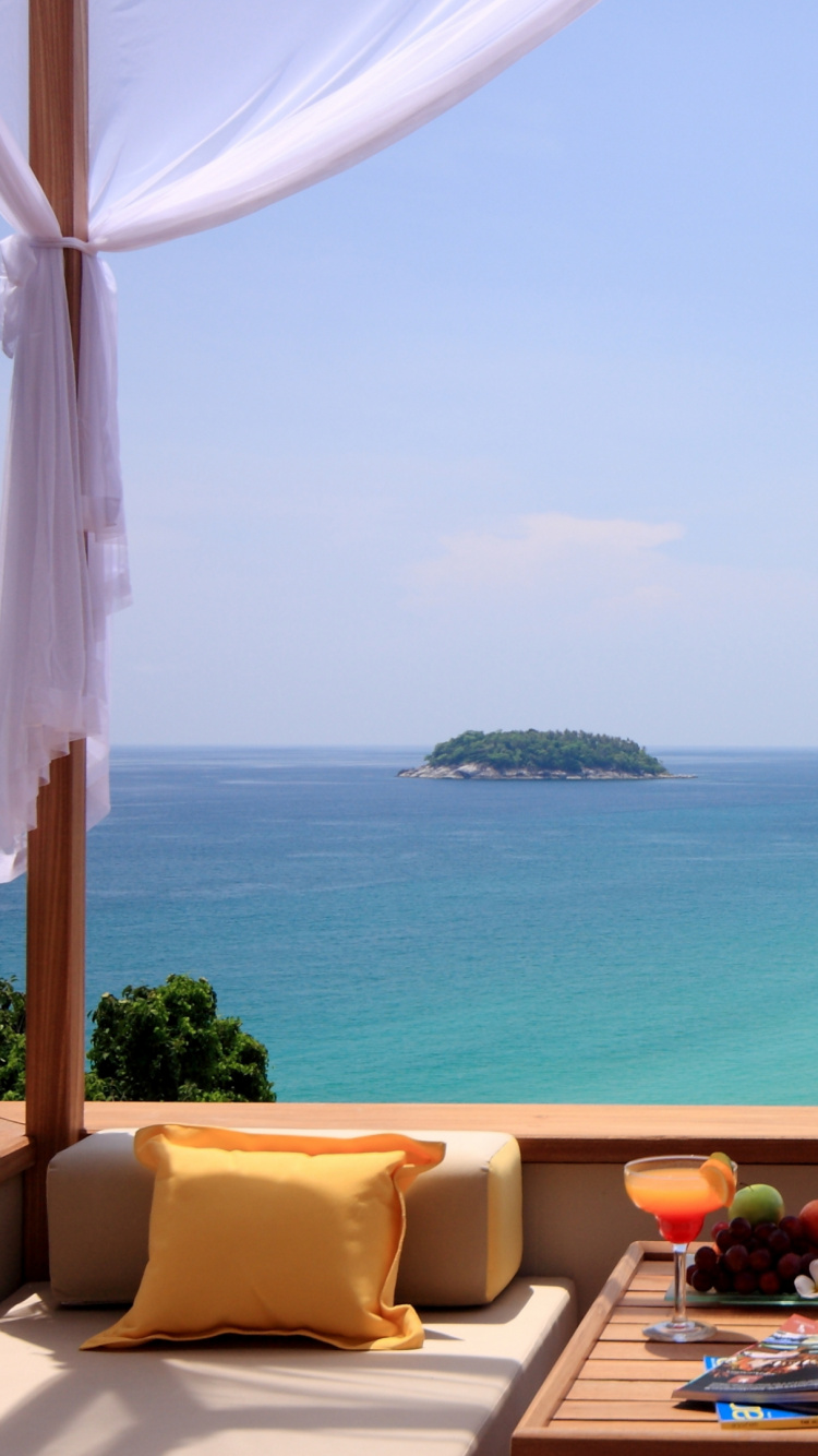 Brown and White Sofa Chairs Near Body of Water During Daytime. Wallpaper in 750x1334 Resolution