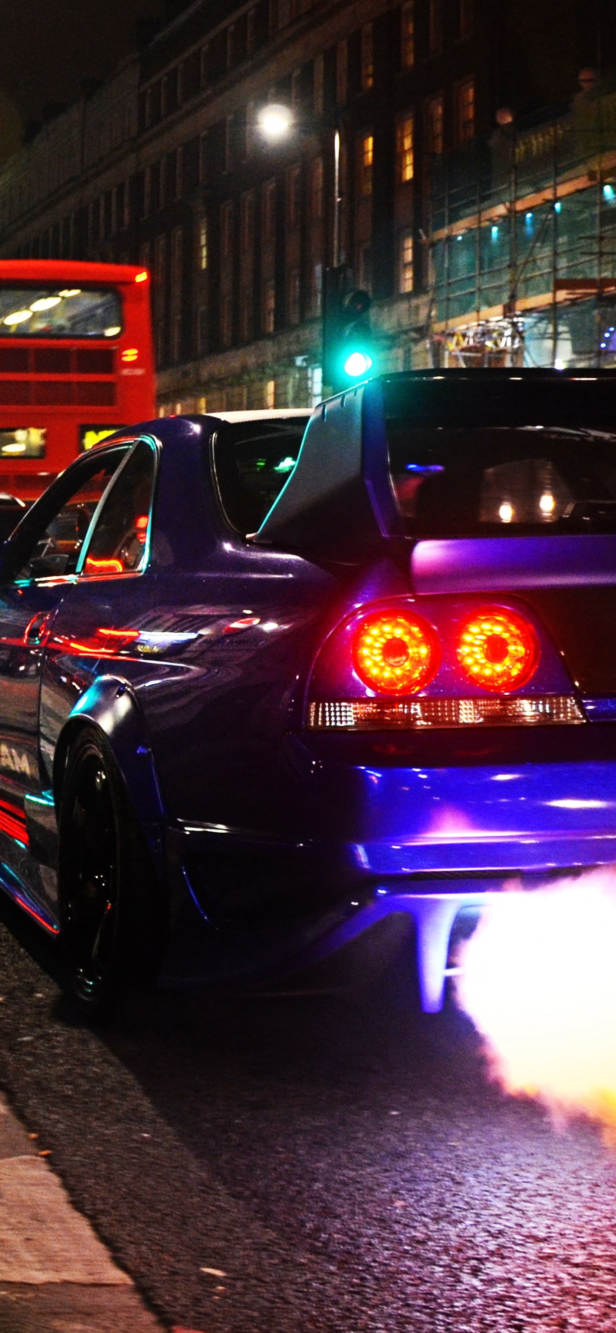 Black Car on Road During Night Time. Wallpaper in 1242x2688 Resolution