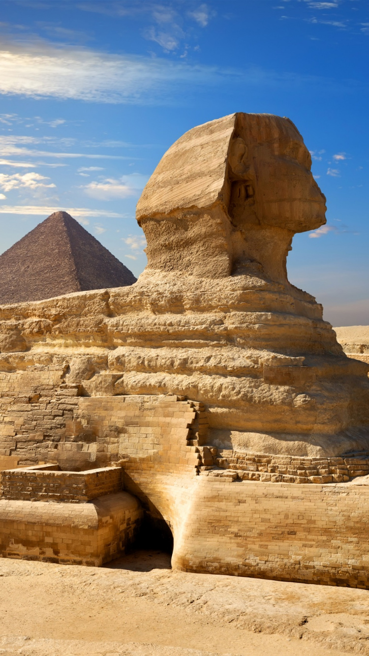 Tagsüber Braune Felsformation Unter Blauem Himmel. Wallpaper in 750x1334 Resolution