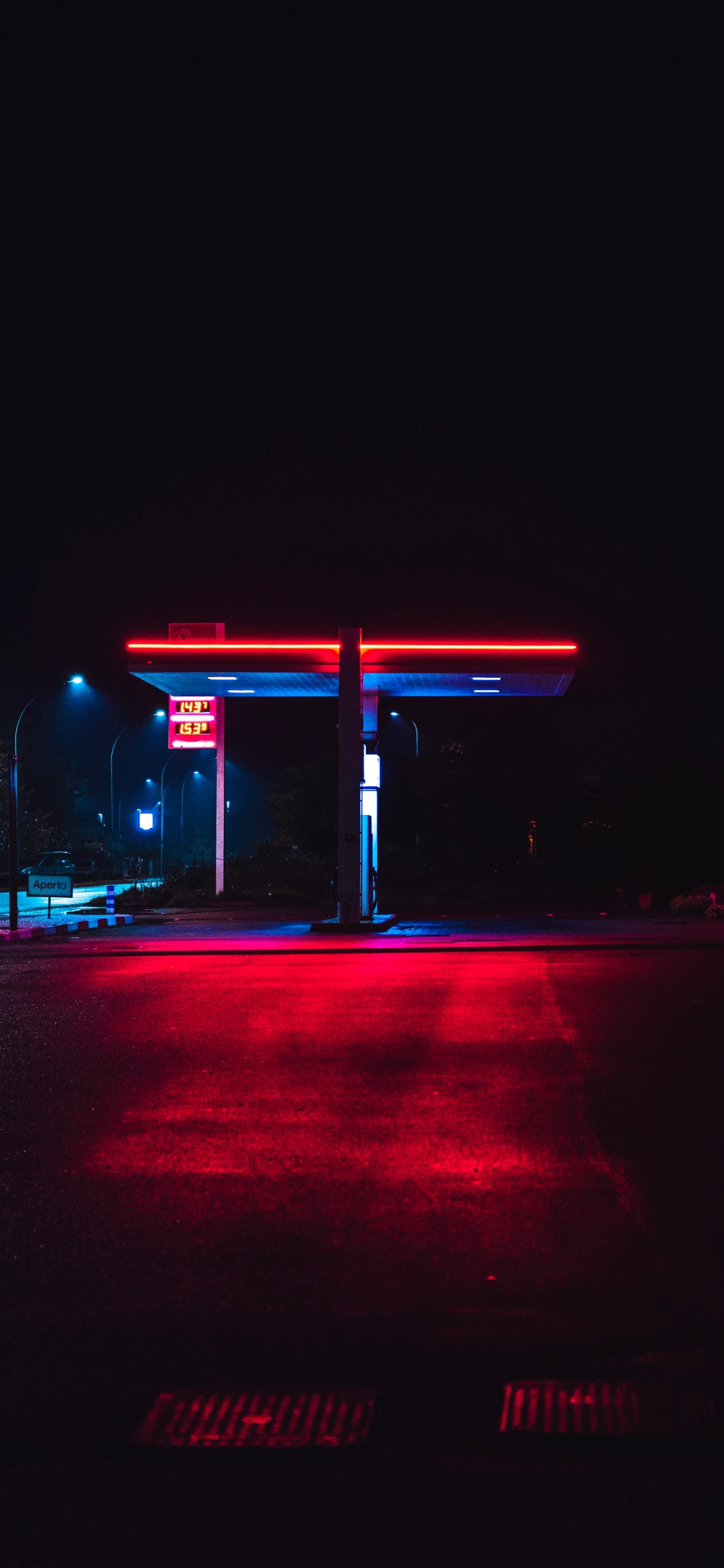 Cars Parked on Side of The Road During Night Time. Wallpaper in 1125x2436 Resolution