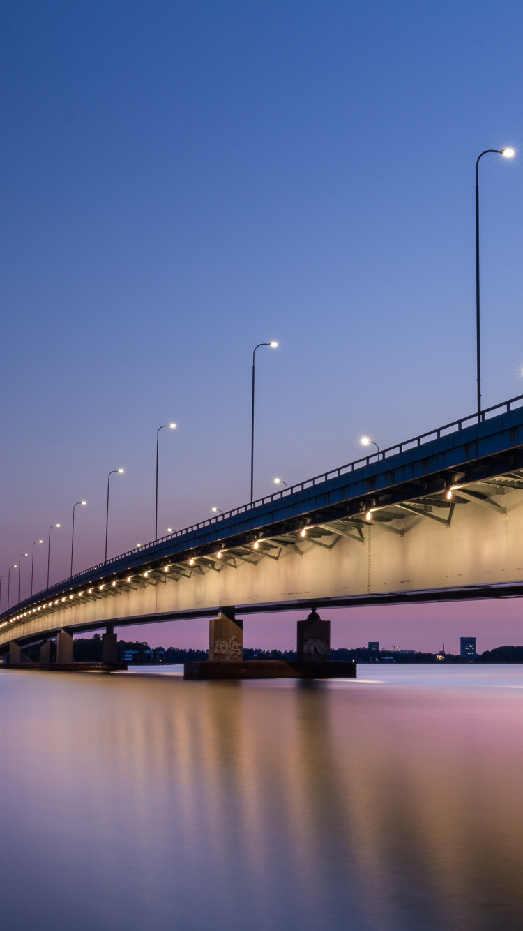 White Bridge Over Water During Night Time. Wallpaper in 750x1334 Resolution
