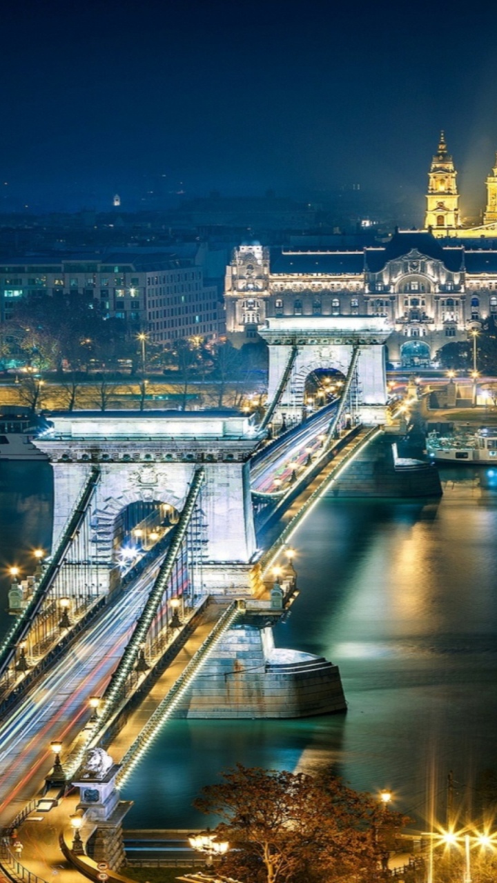 Bridge Over River During Night Time. Wallpaper in 720x1280 Resolution