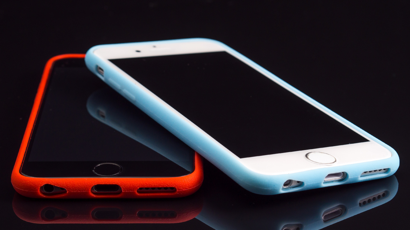 White Iphone 4s With Orange Case. Wallpaper in 1366x768 Resolution