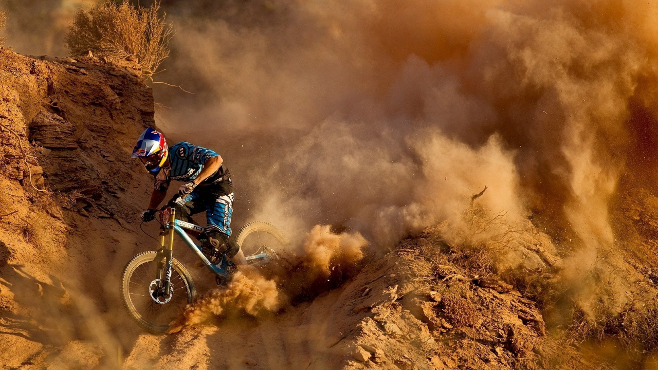 Man Riding Motocross Dirt Bike on Brown Field. Wallpaper in 1280x720 Resolution