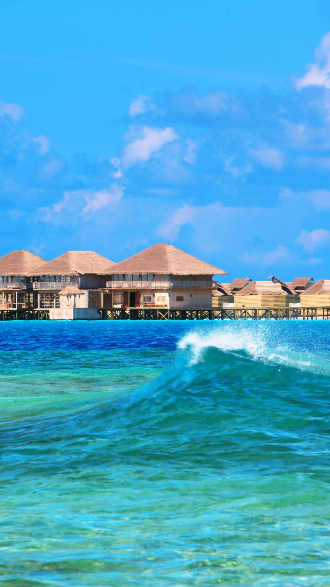 Brown and White Wooden Houses Near Body of Water Under Blue Sky During Daytime. Wallpaper in 1080x1920 Resolution