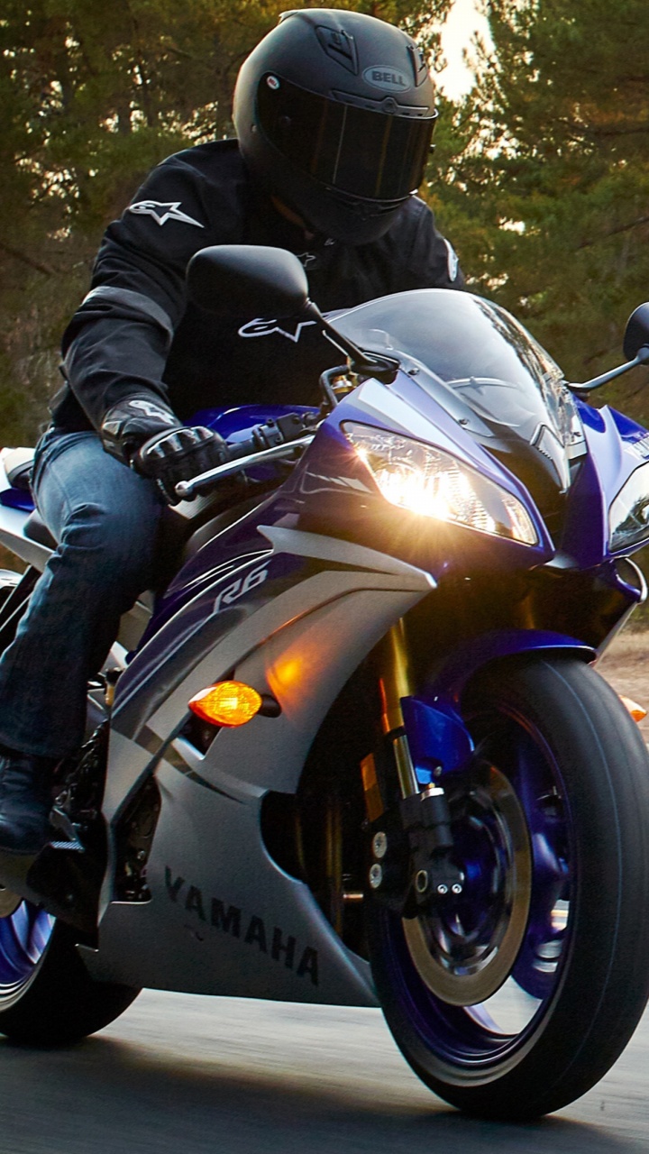 Man in Black Jacket Riding on White and Black Sports Bike. Wallpaper in 720x1280 Resolution