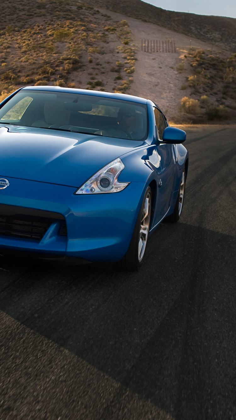 Blue Porsche 911 on Road During Daytime. Wallpaper in 750x1334 Resolution