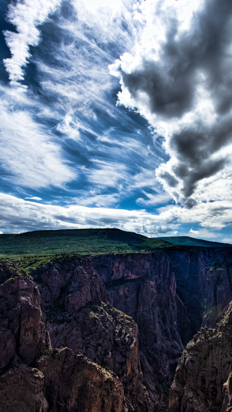 Green and Brown Mountain Under White Clouds and Blue Sky During Daytime. Wallpaper in 750x1334 Resolution