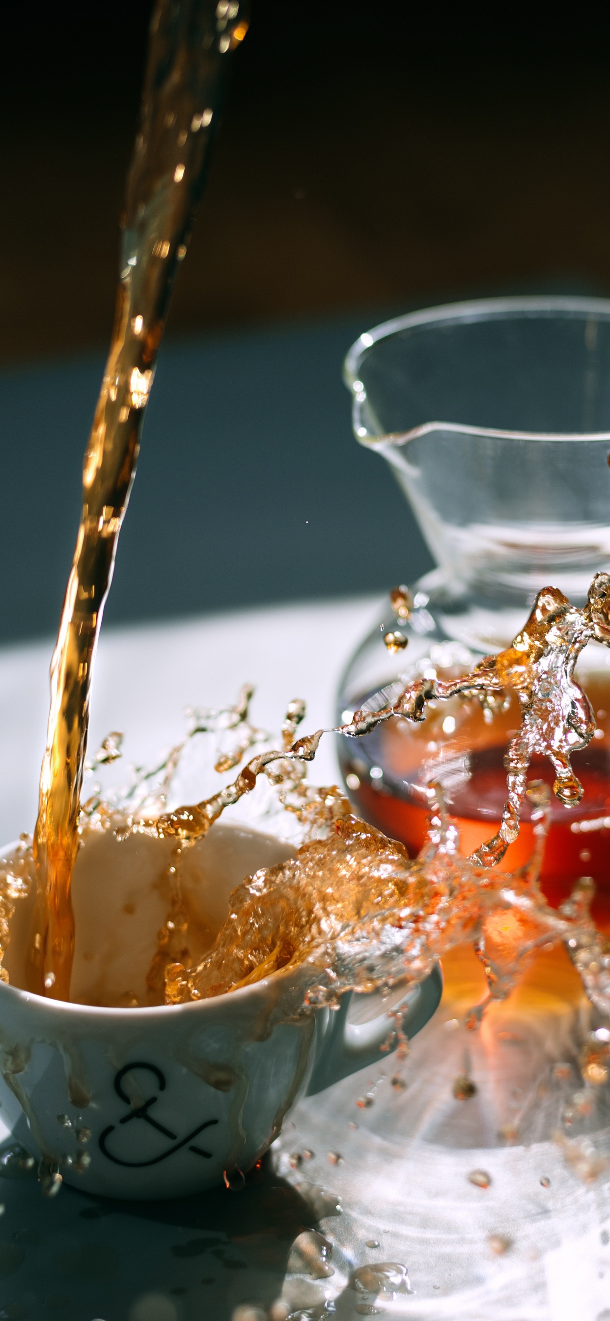 Water Pouring on White Ceramic Cup. Wallpaper in 1242x2688 Resolution