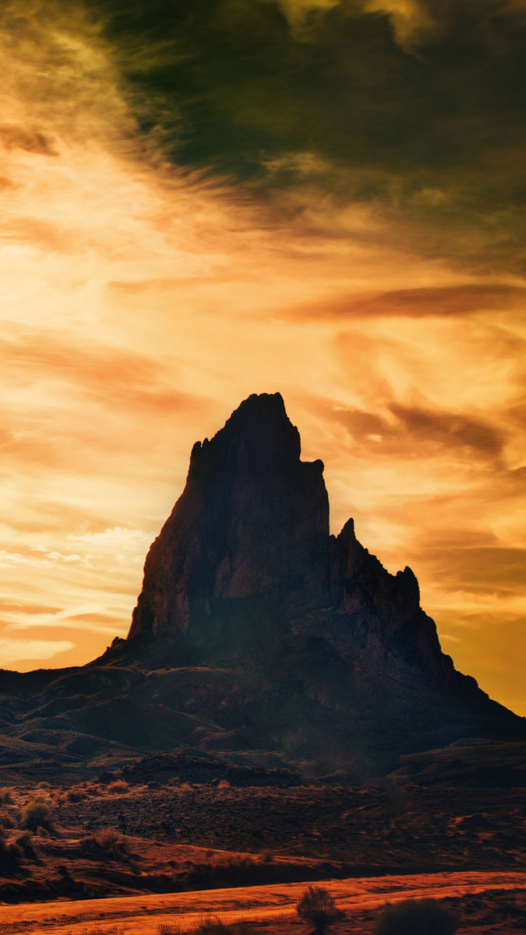 Brown Rocky Mountain Under Cloudy Sky During Daytime. Wallpaper in 750x1334 Resolution