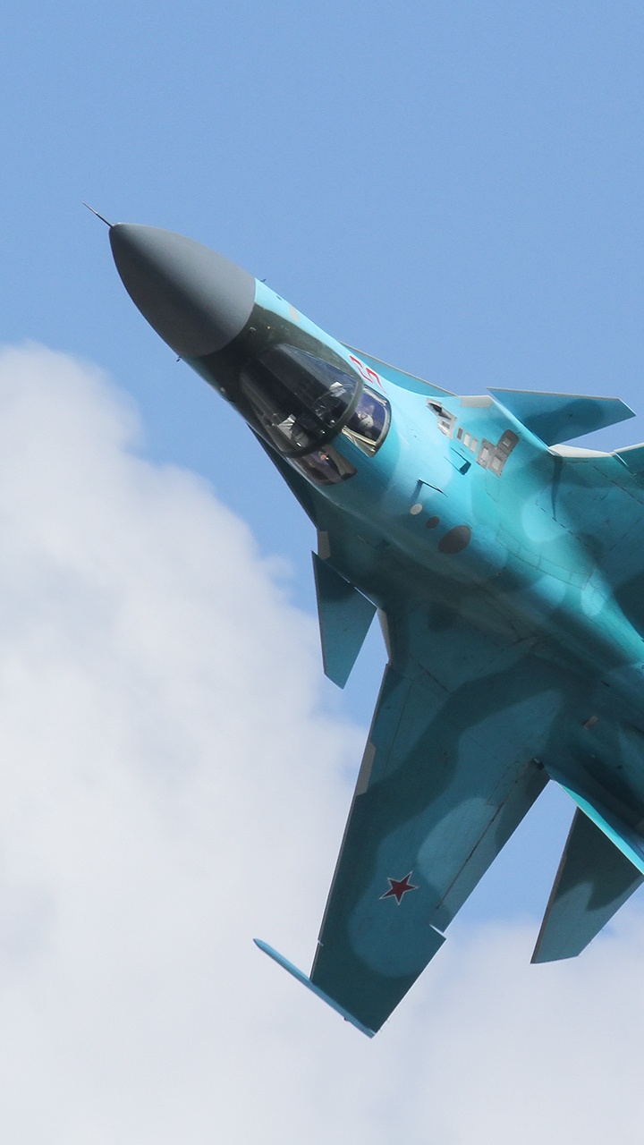 Gray Fighter Jet Flying in The Sky. Wallpaper in 720x1280 Resolution