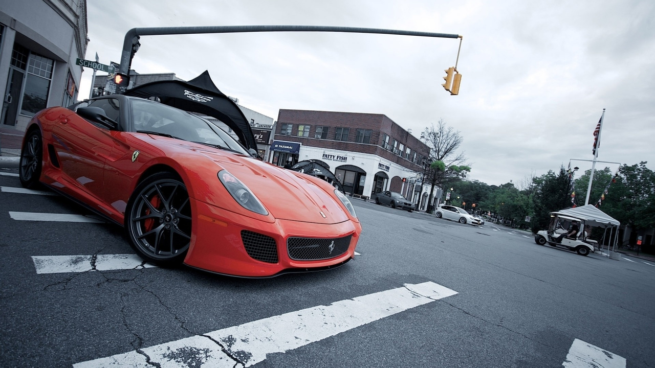 Red Ferrari Sports Car on Road During Daytime. Wallpaper in 1280x720 Resolution
